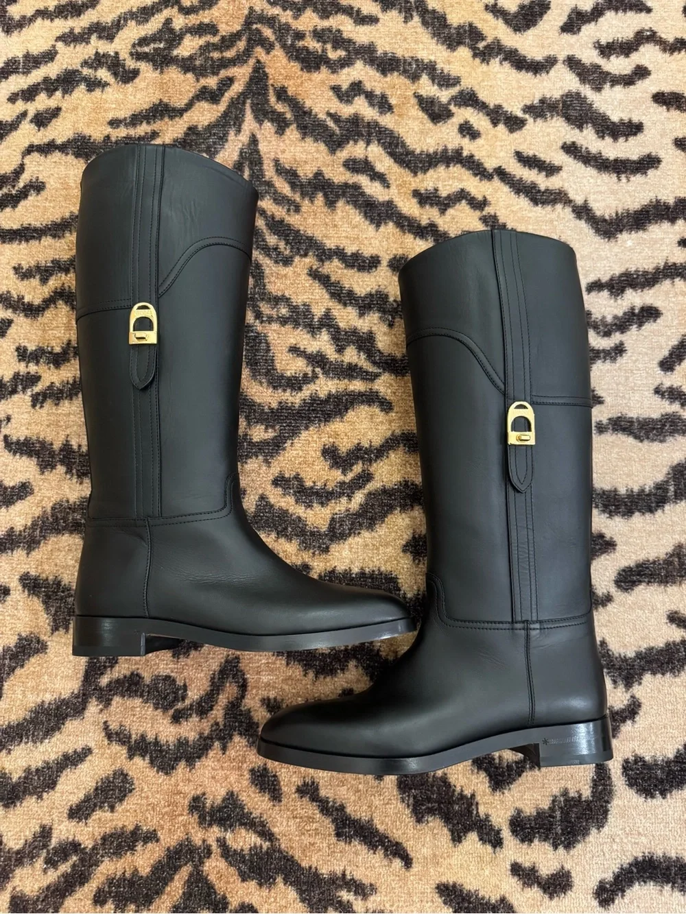 GUCCI Women’s Black Leather Knee-High Riding Boots with Gold Buckle